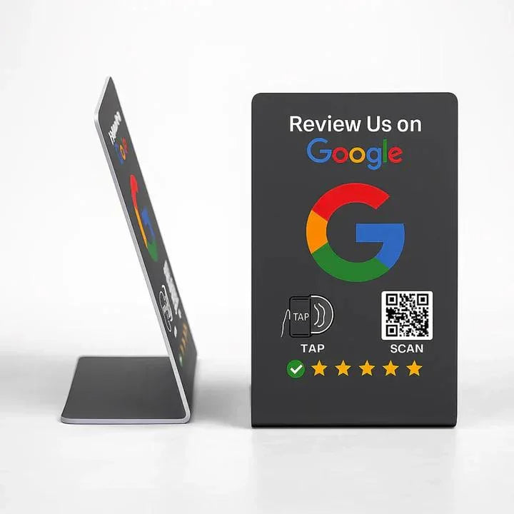 Black Google review sign with colorful logo, QR code, tap icon, and five-star rating on white background