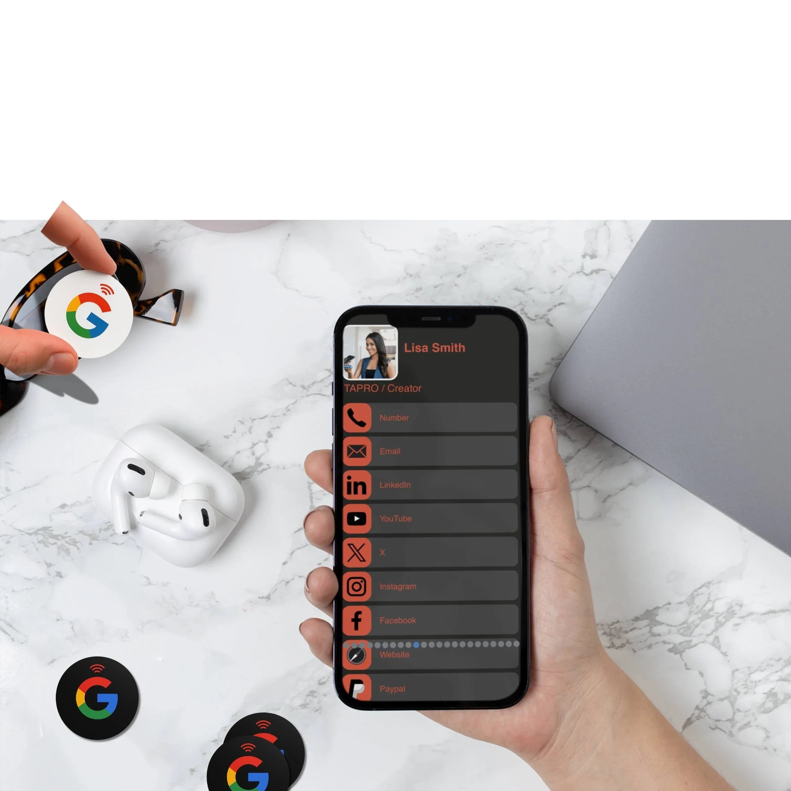 Hand holding smartphone displaying Lisa Smith digital contact card with social media icons on marble table