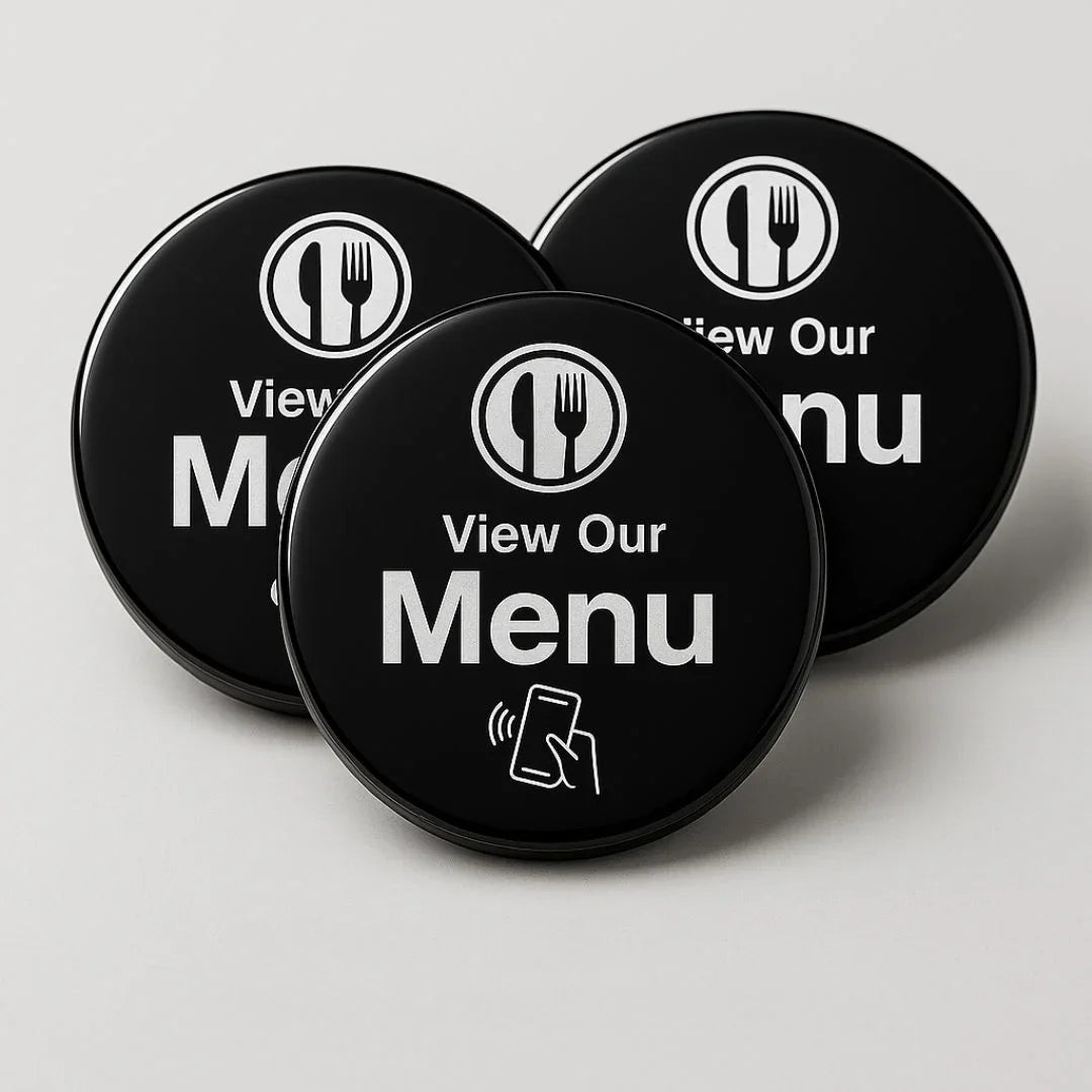 Black circular NFC menu buttons with white fork-knife icon and tap-to-view text, for contactless customer engagement and feedback collection.