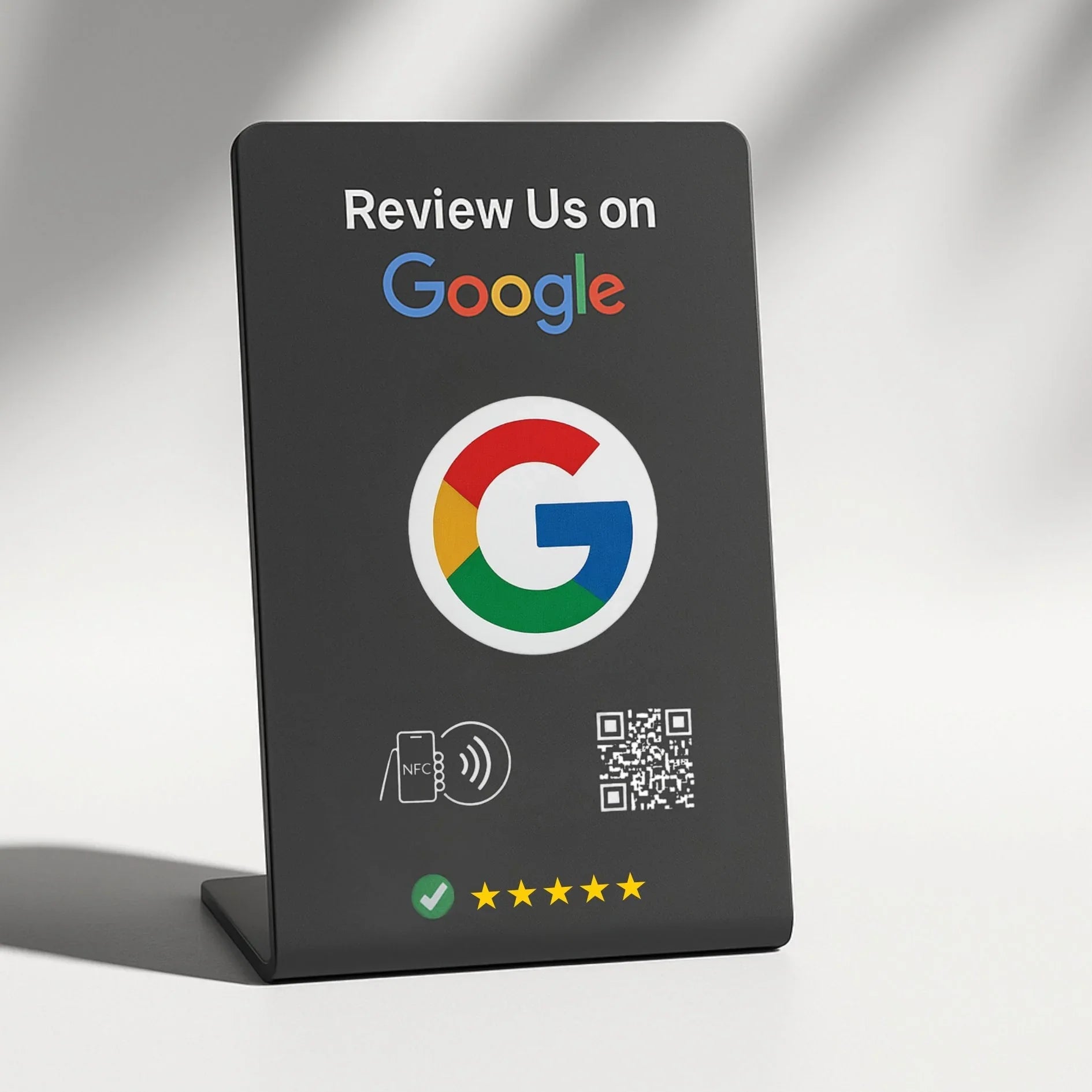 Black stand with Google logo and QR code on a gray background