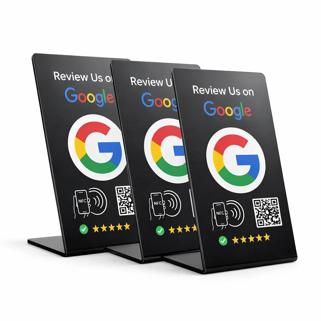Three black sign stands with Google logo and 'Review Us on Google' text on a white background