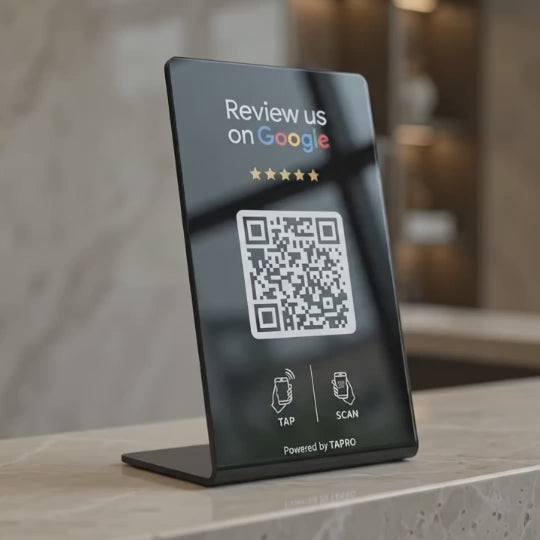 TAPro NFC Google Review Stand with QR code displayed beside a smartphone for professional business review collection